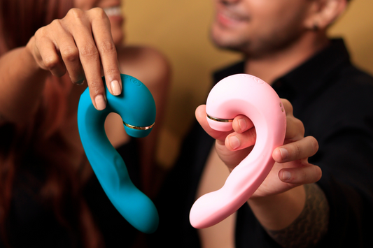 Couple holding two colorful Shiver vibrators, showcasing the unique design and versatility, perfect for reigniting passion and intimacy.