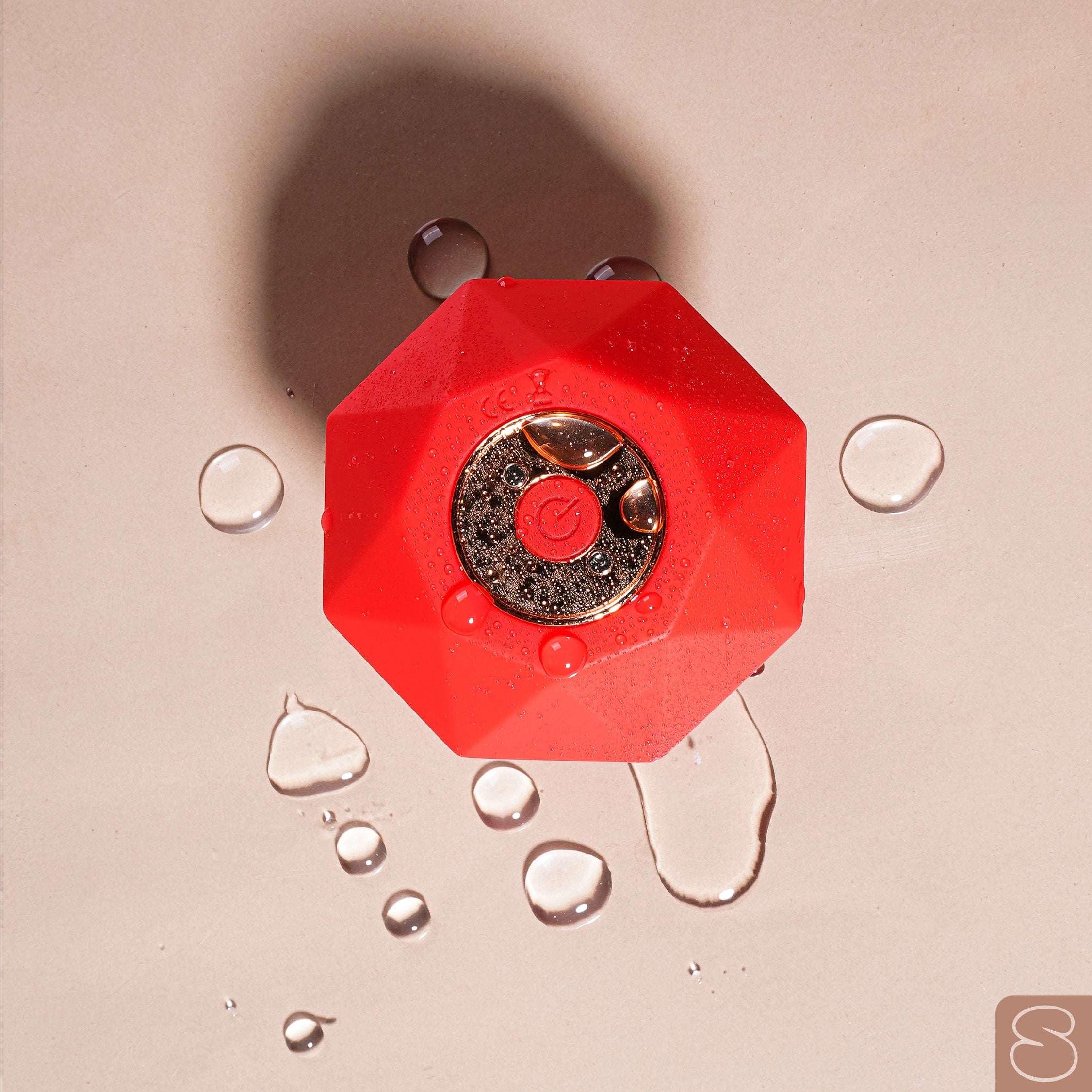 Red Sparkle Pulsation Massager India with water droplets showcasing its waterproof feature