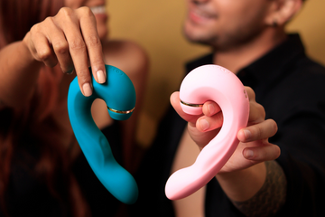 Couple holding two colorful Shiver vibrators, showcasing the unique design and versatility, perfect for reigniting passion and intimacy.