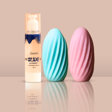 Buy Couple Massager Combo India – Includes dual-textured massagers in pink and blue with a water-based lubricant bottle