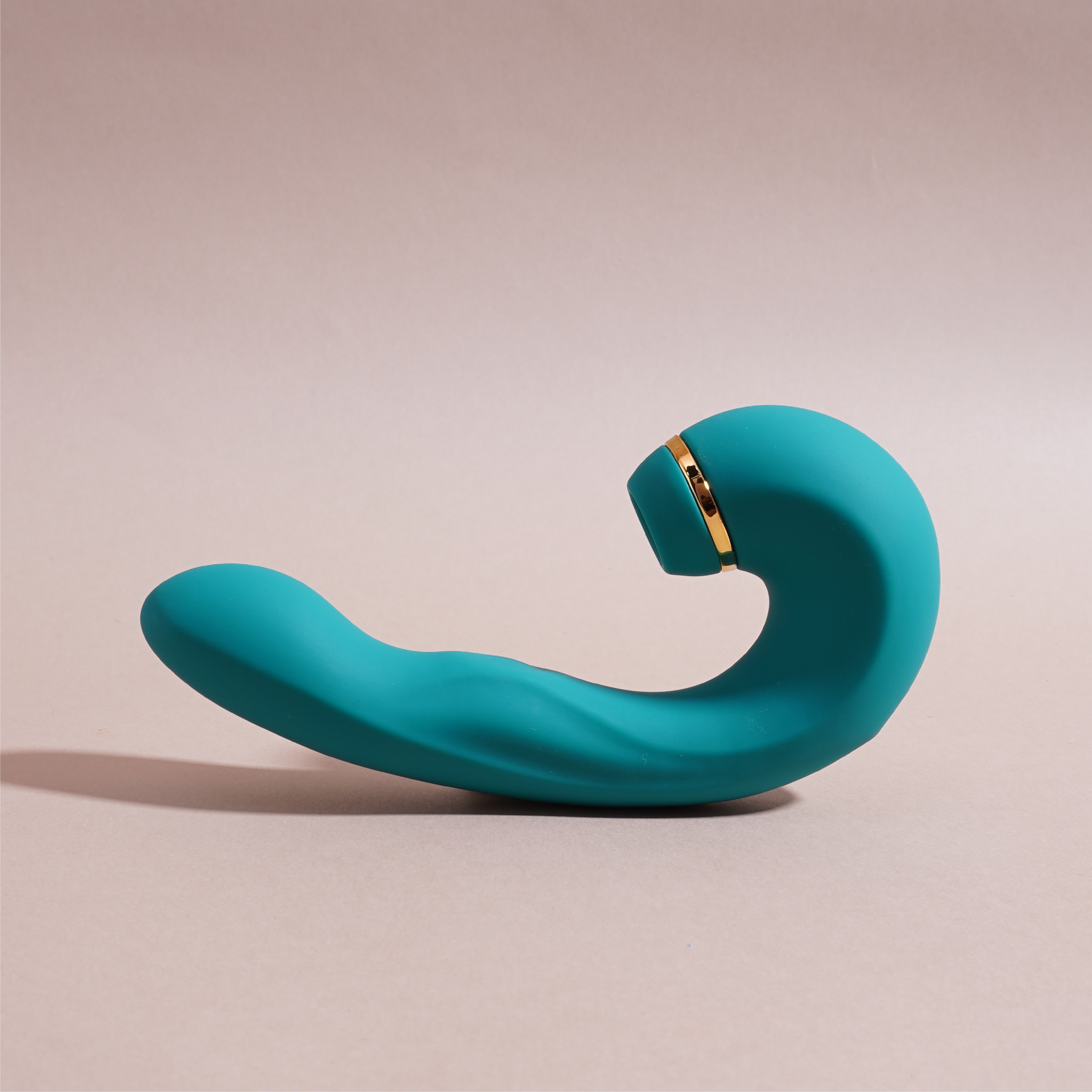 Buy Couple Massager Combo India – Shiver massager with elegant curve and premium gold detailing on pastel backdrop